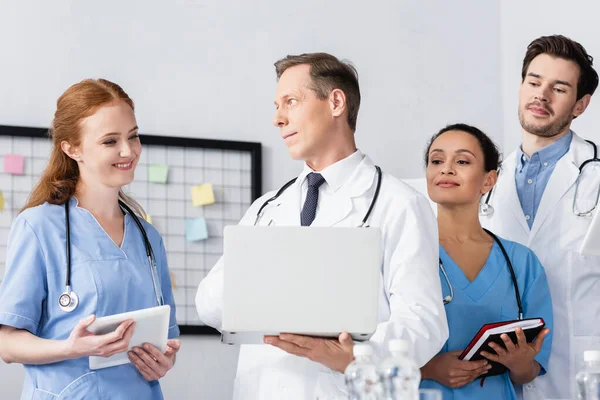 Multiethnic Hospital Staff Digital Tablet Laptop Smiling While Working Clinic — Stock Photo, Image