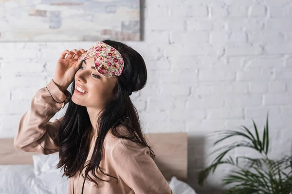 Smiling Young Brunette Woman Sitting Bed Sleep Mask — Stock Photo, Image