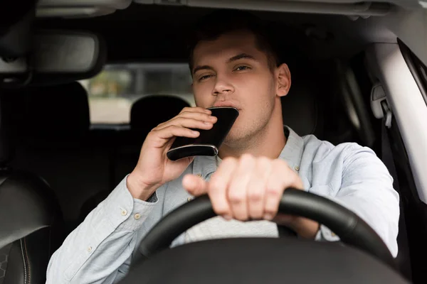 Young Man Drinking Alcohol Flask While Driving Car Blurred Foreground — Stock Photo, Image