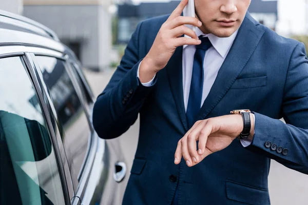 Cropped View Businessman Looking Wristwatch While Talking Smartphone Car — Stock Photo, Image