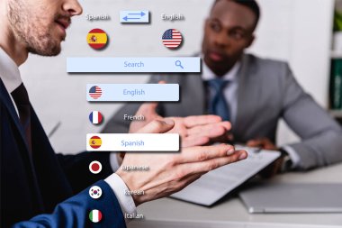 translator gesturing near african american businessman on blurred background, translation app interface illustration clipart