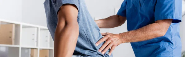 Cropped View Mature Chiropractor Working African American Man Banner — Stock Photo, Image