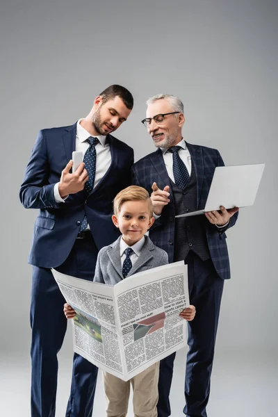 Mature Businessman Talking Son Pointing Finger Grandson Holding Newspaper Grey — Stock Photo, Image