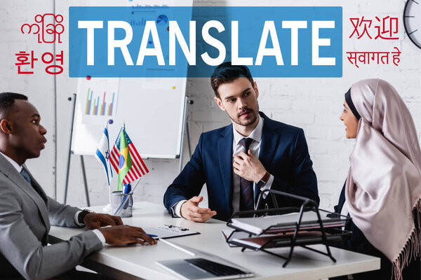 multicultural business partners talking in office during meeting with interpreter, translate lettering near hieroglyphs illustration. Translation: "translate"