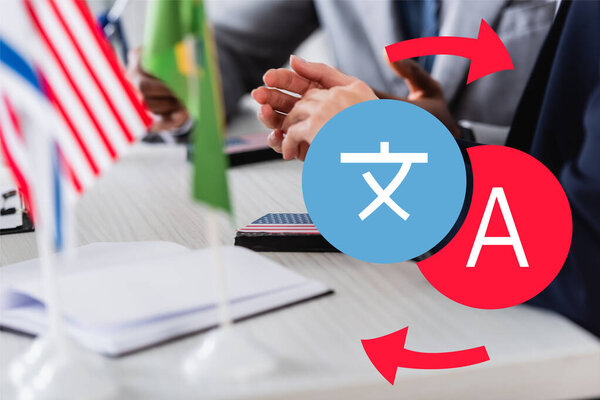 cropped view of interpreter near digital translator and african american businessman, illustration of hieroglyph and letter