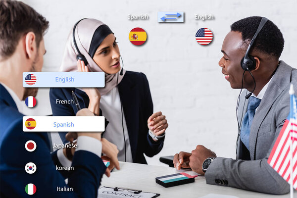 interracial business partners in headsets near digital translator on blurred foreground, translation application interface illustration