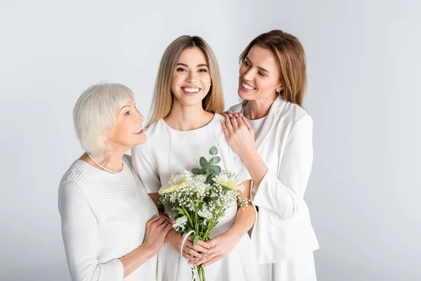 Cheerful Young Woman Smiling While Holding Flowers Mother Granny Isolated — Stock Photo, Image