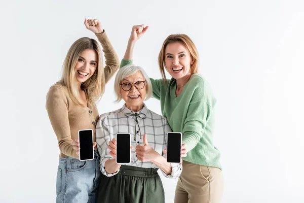 Three Generation Excited Women Holding Smartphones Blank Screen Isolated White — Stock Photo, Image