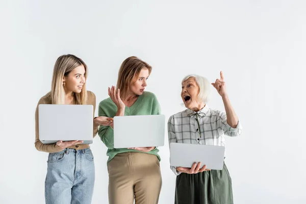 Mother Young Daughter Holding Laptops Looking Senior Woman Pointing Finger — Stock Photo, Image
