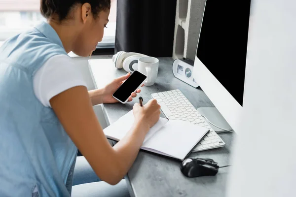 Young African American Freelancer Writing Notebook While Holding Smartphone Blank — Stock Photo, Image