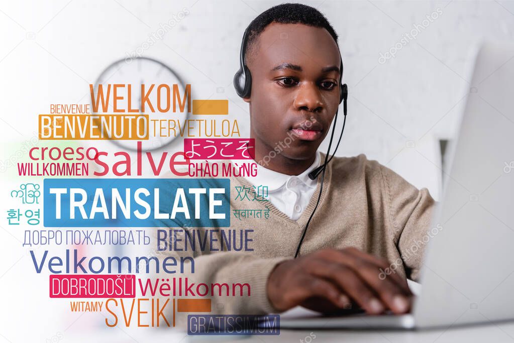 african american interpreter in headset near laptop, translate lettering near words in foreign languages. Translation: 
