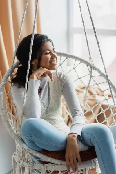 Happy African American Woman Looking Away While Relaxing Hanging Chair — Stock Photo, Image