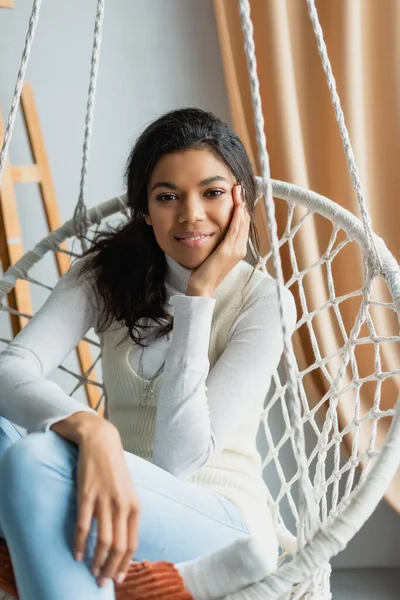 Happy African American Woman Sitting Hanging Chair Smiling Camera Blurred — Stock Photo, Image