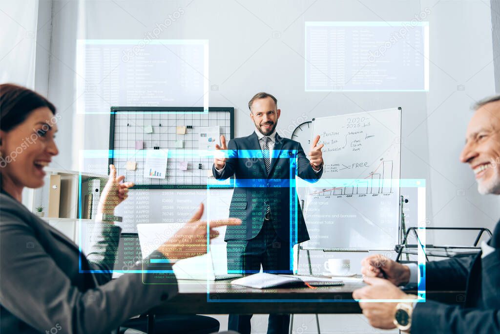 Cheerful investor pointing with fingers at smiling businesspeople on blurred foreground, illustration of screen with data 