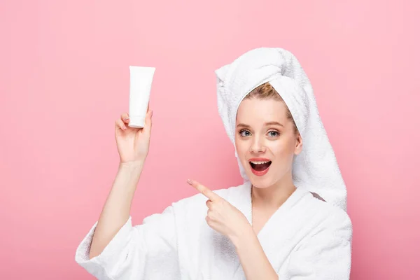 Excited Young Woman Bathrobe Towel Head Pointing Tube Hand Cream — Stock Photo, Image
