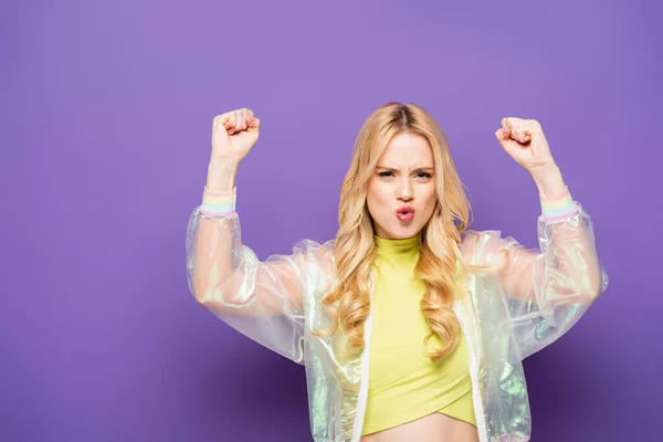 Blonde Young Woman Colorful Outfit Showing Yeah Gesture Purple Background — Stock Photo, Image