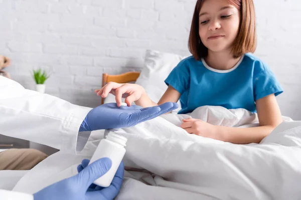 Smiling Girl Taking Pill Doctor Blurred Background — Stock Photo, Image