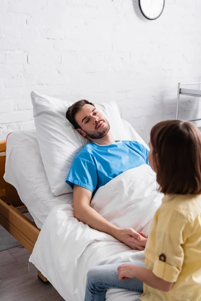 Girl Holding Hand Diseased Father Lying Hospital Bed — Stock Photo, Image