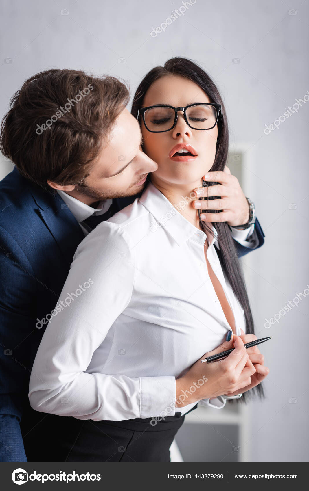 Man unbuttoning women's shirt discount