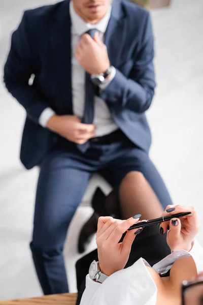 Partial View Sexy Businesswoman Big Bust Businessman Touching Tie Blurred — Stock Photo, Image