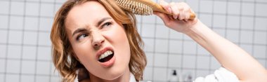 displeased woman brushing hair in bathroom, banner clipart
