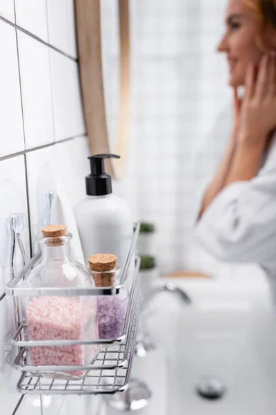 Bottles Sea Salt Dispenser Body Lotion Woman Blurred Background — Stock Photo, Image