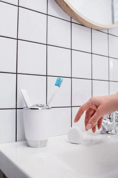 Cropped View Woman Reaching Container Dental Floss Bathroom — Stock Photo, Image