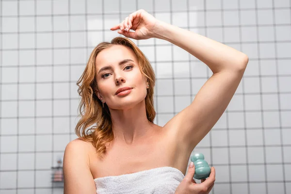 Woman White Towel Applying Deodorant Roll Bathroom — Stock Photo, Image