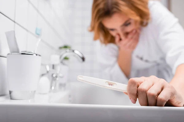 Pregnancy Test Hand Pregnant Woman Bathrobe Feeling Nausea Blurred Background — Stock Photo, Image