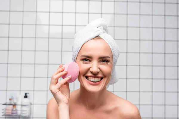 Joyful Woman Towel Head Holding Cleansing Silicone Brush Bathroom — Stock Photo, Image