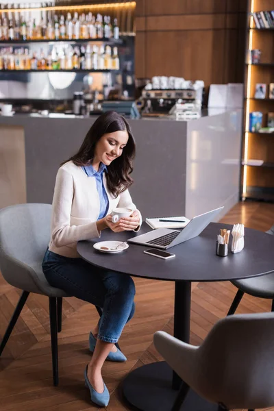 Joyful Freelancer Holding Cup Coffee Laptop Mobile Phone Restaurant — Stock Photo, Image