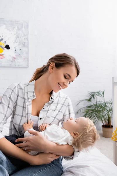 Happy Mother Lulling Toddler Son Bedroom — Stock Photo, Image
