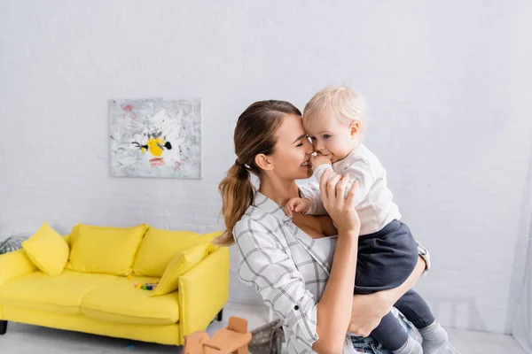 Happy Young Woman Closed Eyes Holding Little Child Home — Stock Photo, Image