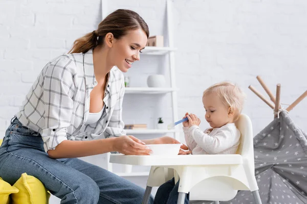 Little Boy Sitting Kids Chair Spoon Happy Mother — Stock Photo, Image