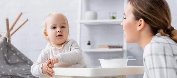 Young Woman Open Mouth Looking Child Sitting Kids Chair Bowl — Stock Photo, Image