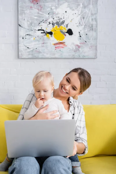 Cheerful Freelancer Sitting Laptop Toddler Son Yellow Sofa — Stock Photo, Image