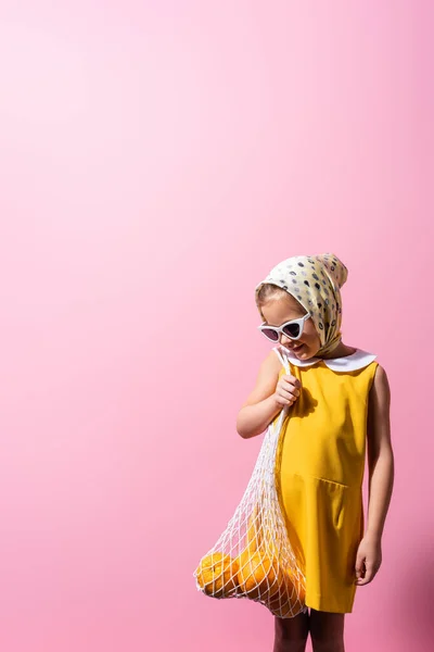 Happy Girl Headscarf Sunglasses Holding Reusable String Bag Oranges Pink — Stock Photo, Image