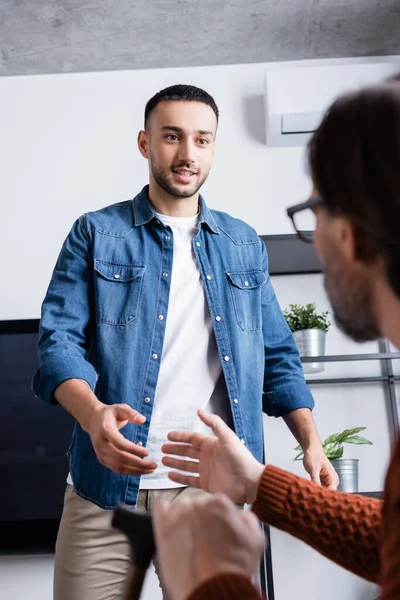 Young Hispanic Man Outstretched Hand Father Blurred Foreground — Stock Photo, Image