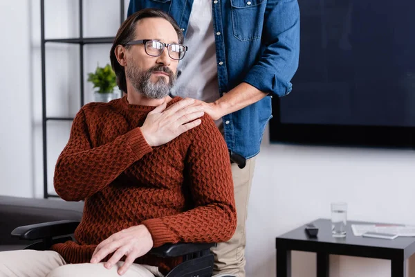 Man Touching Shoulder Thoughtful Disabled Father Looking Away Wheelchair — Stock Photo, Image