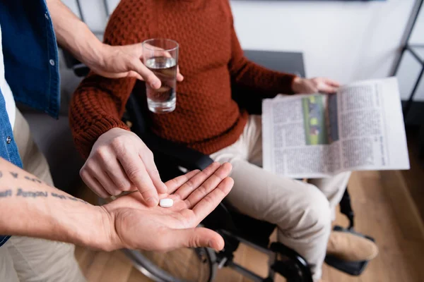 Selective Focus Disabled Man Taking Pill Son Holding Glass Water — Stock Photo, Image