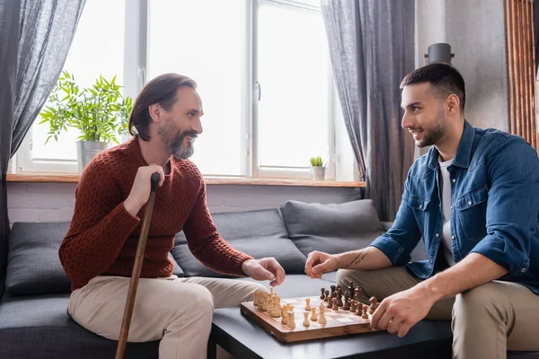 Happy Interracial Father Son Looking Each Other While Playing Chess — Stock Photo, Image