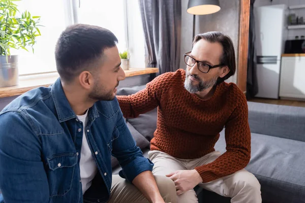 Interracial Dad Son Looking Each Other While Talking Sofa Home — Stock Photo, Image