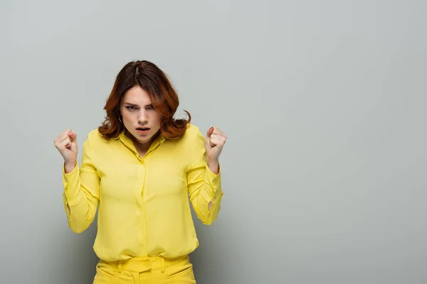 Displeased Woman Clenched Fists Looking Camera Grey — Stock Photo, Image