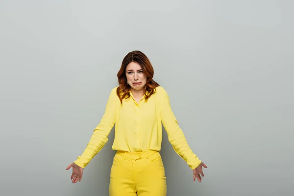 Frustrated Woman Showing Shrug Gesture While Grimacing Grey — Stock Photo, Image