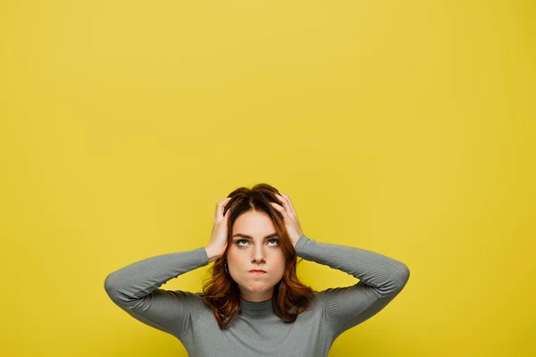 Displeased Woman Looking While Suffering Headache Touching Head Isolated Yellow — Stock Photo, Image