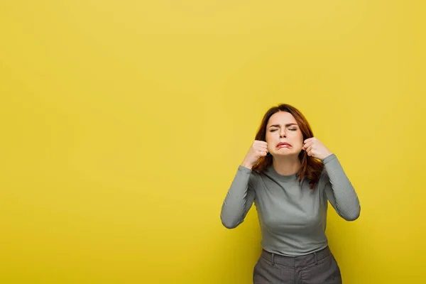 Frustrated Woman Clenched Fists Crying Isolated Yellow — Stock Photo, Image