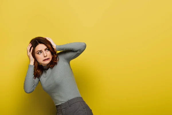 Scared Woman Curly Hair Looking Away Yellow — Stock Photo, Image