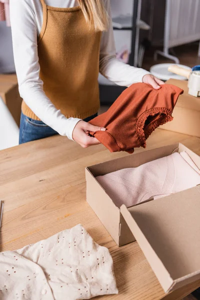 Partial View Proprietor Holding Sweater Box Clothing Showroom — Stock Photo, Image