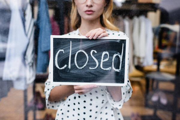Partial View Proprietor Holding Board Closed Lettering Showroom Blurred Background Stock Image