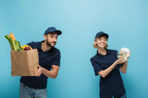 Happy Interracial Couriers Holding Paper Bag Lunch Box Fresh Food — Stock Photo, Image